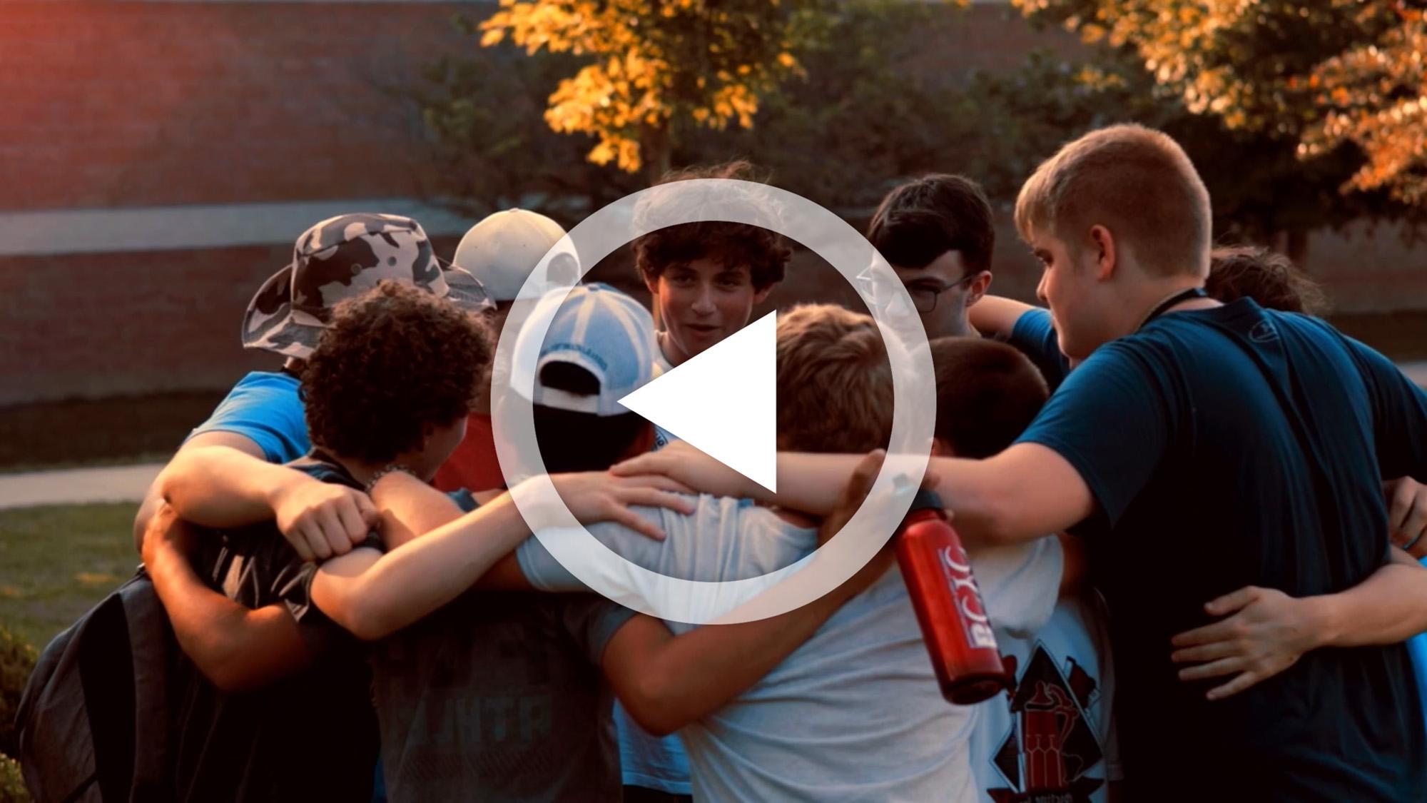 A group of students in a huddle during BCYC