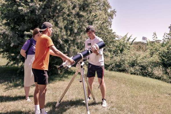 Students setting up a telescope